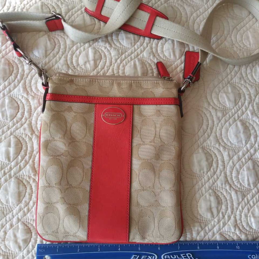 Coach beige canvas with pink leather crossbody bag. In like new condition.